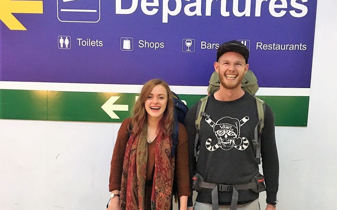Two excited travellers heading for departures!